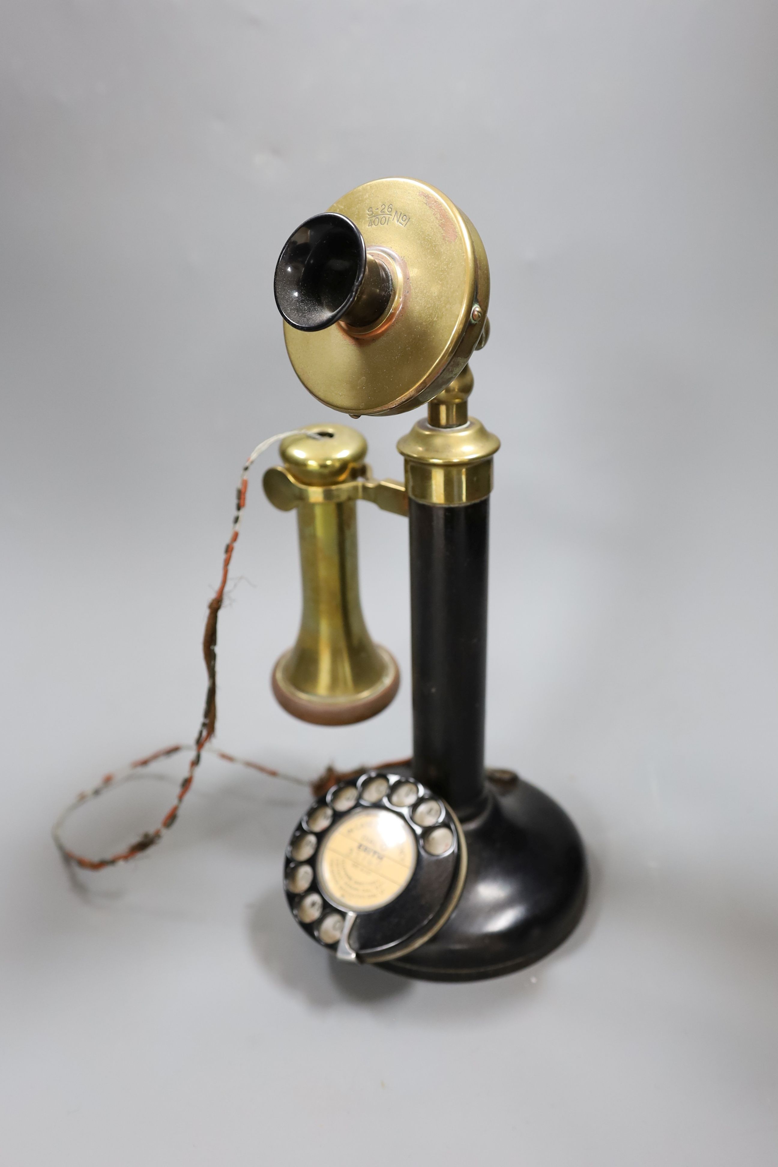 A brass mounted pillar telephone, 34cms high.